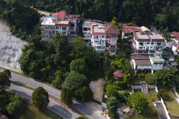 Bungalow on hillside with magnificent view of Bukit Melawati. Taman Melawati. 