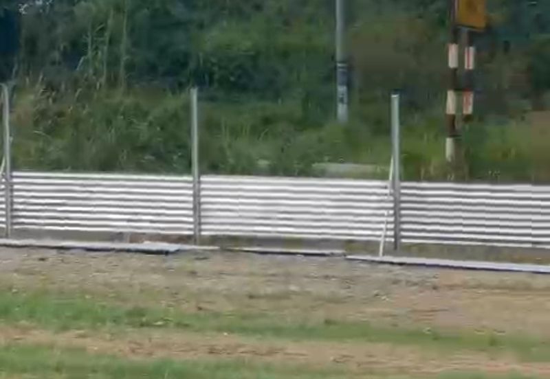 Flat land beside KL-Ipoh Trunk Road near Komuter