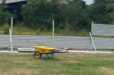 Flat land beside KL-Ipoh Trunk Road near Komuter