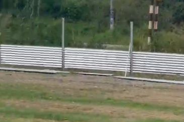 Flat land beside KL-Ipoh Trunk Road near Komuter