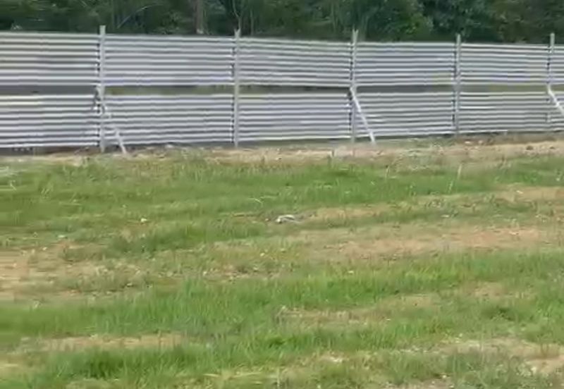 Flat land beside KL-Ipoh Trunk Road near Komuter